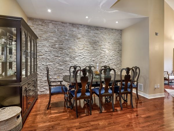 Spacious Dining Room with Feature Stone Wall
