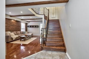Oak Staircase with Metal Pickets Leads to Upper Level